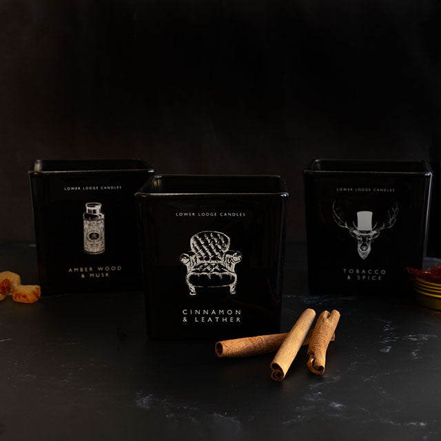Men's Tobacco & Spice Deluxe Scented Candles from Lower Lodge Candles. Amber Wood & Musk Deluxe Scented Candle, Cinnamon & Leather Deluxe Scented Candle and the Tobacco & Spice Deluxe Scented Candle.