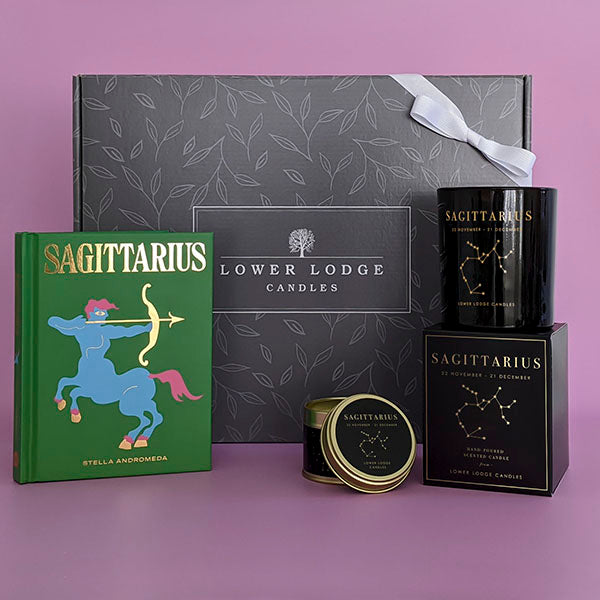 Sagittarius Birthday Gift Box from Lower Lodge Candles. Includes a Sagittarius Zodiac Candle, matching Sagittarius Zodiac Tin Candle and Sagittarius Book by Stella Andromeda.