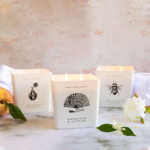 His & Hers Deluxe Candle Range from Lower Lodge Candles. Featuring Bergamot & Peach Deluxe Scented Candle, Mandarin & Jasmin Deluxe Scented Candle and White Pepper & Peony Deluxe Scented Candle.