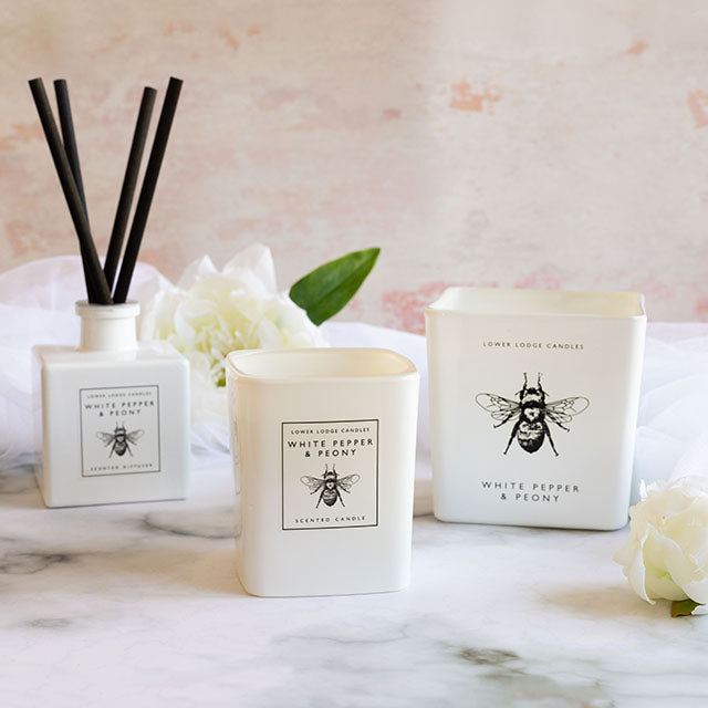 His & Hers White Pepper & Peony Product Range Featuring White Pepper & Peony Luxury Scented Diffuser, White Pepper & Peony Scented Candle and the White Pepper & Peony Deluxe Scented Candle from Lower Lodge Candles.